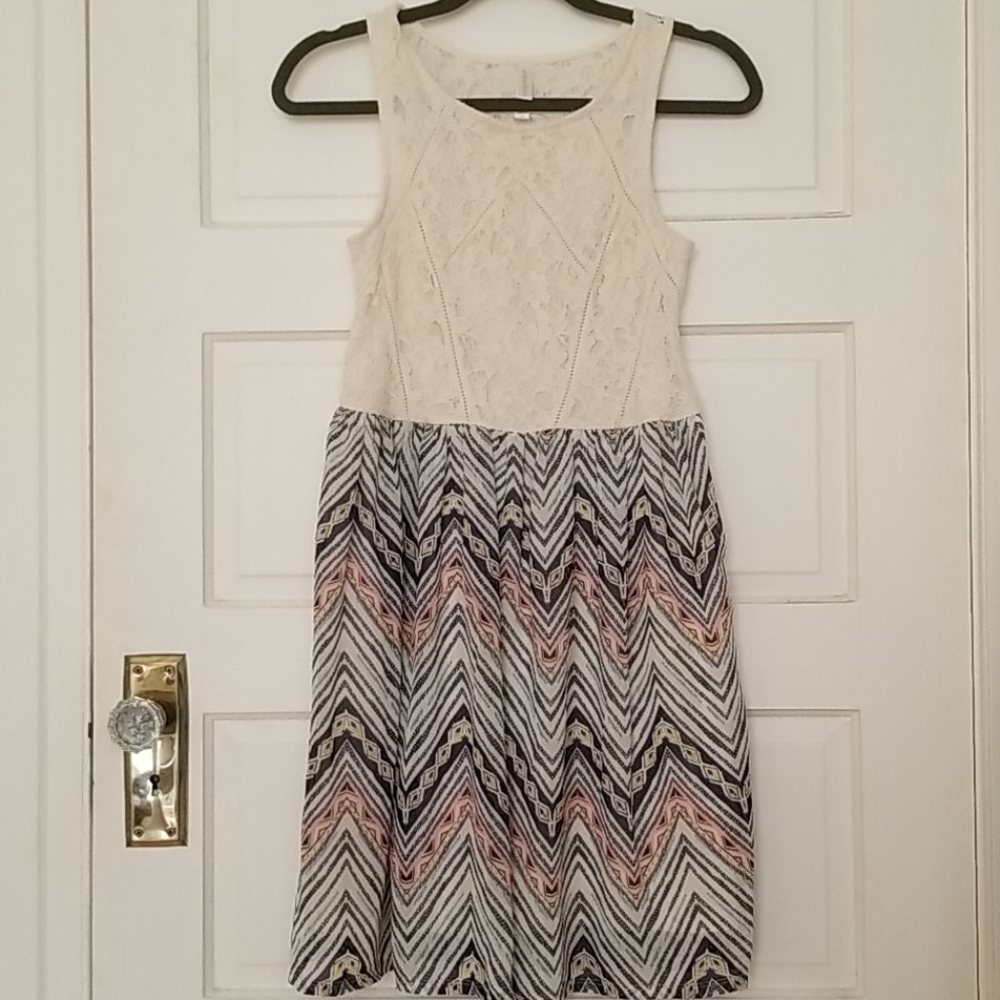 Sleeveless lace top with pattern bottom dress.